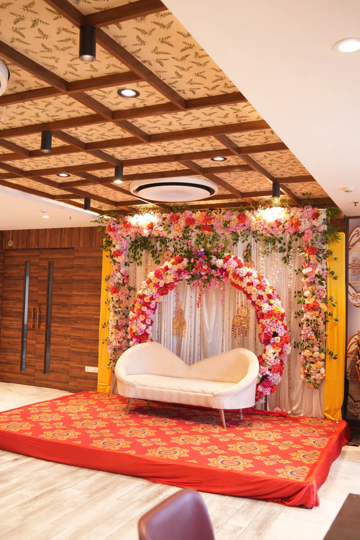 The Yellow Turtle Baguiati banquet hall with floral celebration stage